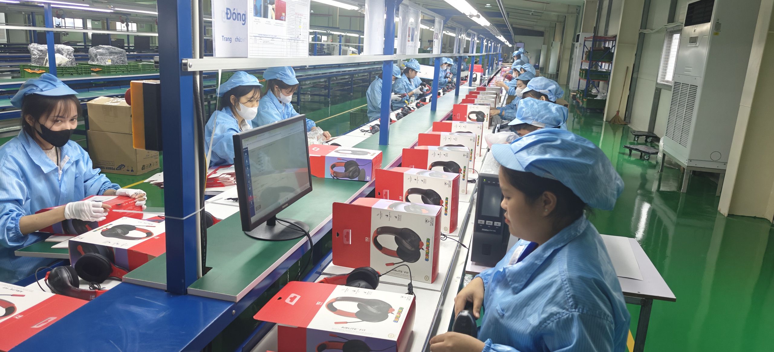 Assembly line with operators at workstations