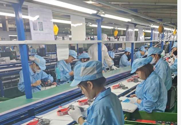 Operators assembling products on the line