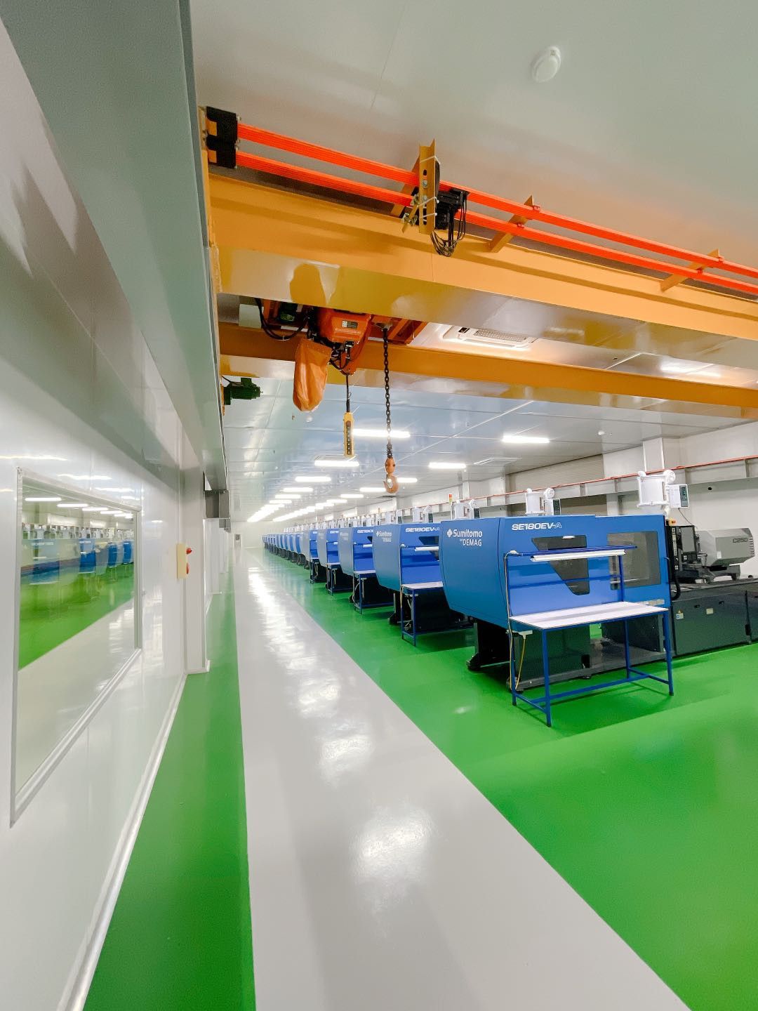 Injection molding workshop with overhead crane